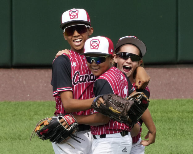 A 12-run second inning propels Canada past Puerto Rico in an elimination game Saturday